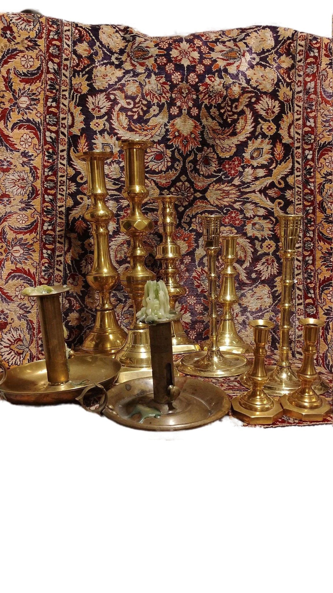 https://estatefreshaustin.com/cdn/shop/products/lot-of-10-19th-century-antique-brass-candlesticks-some-brass-pushup-candlesticksestate-fresh-austin-495709.jpg?v=1707939654